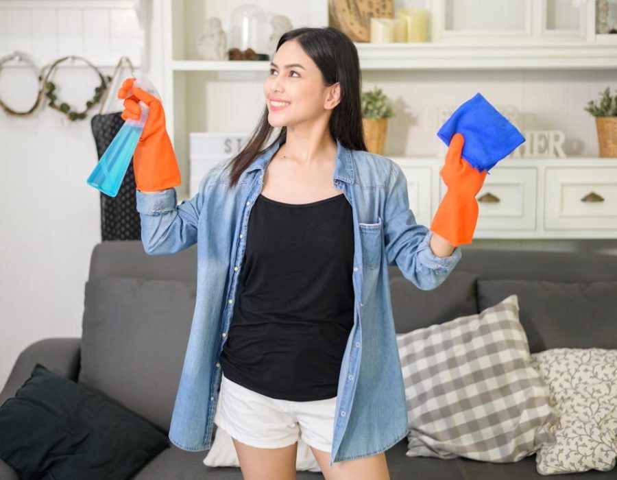 a-woman-with-cleaning-gloves-using-alcohol-spray-sanitiser-to-cleaning-house